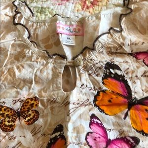 Butterfly scrub with light brown background